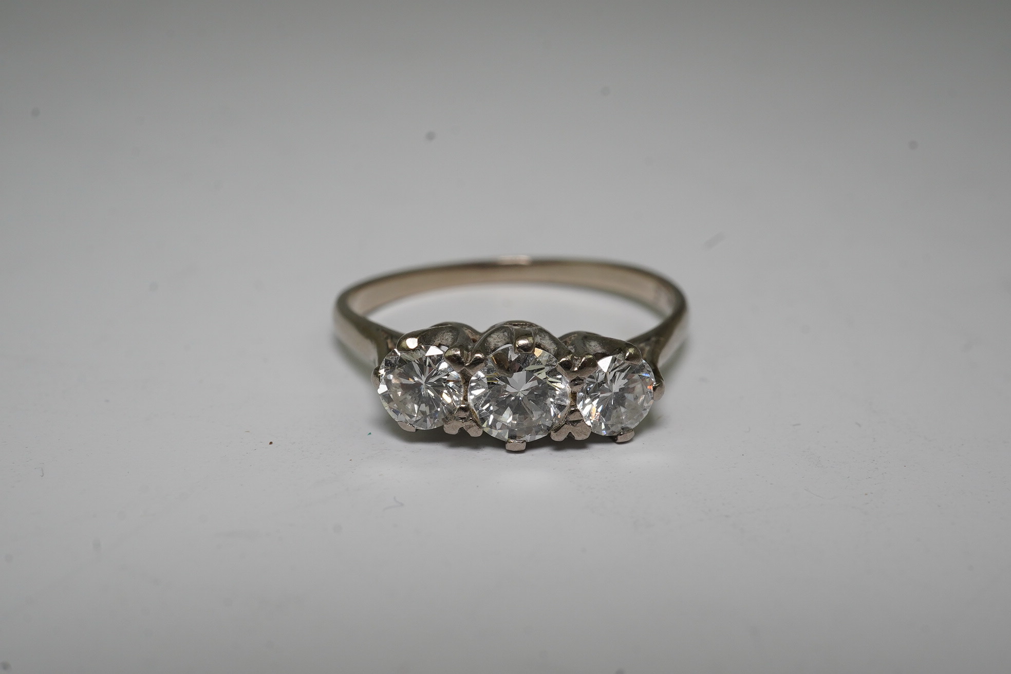 An 18ct white gold and three stone diamond set ring